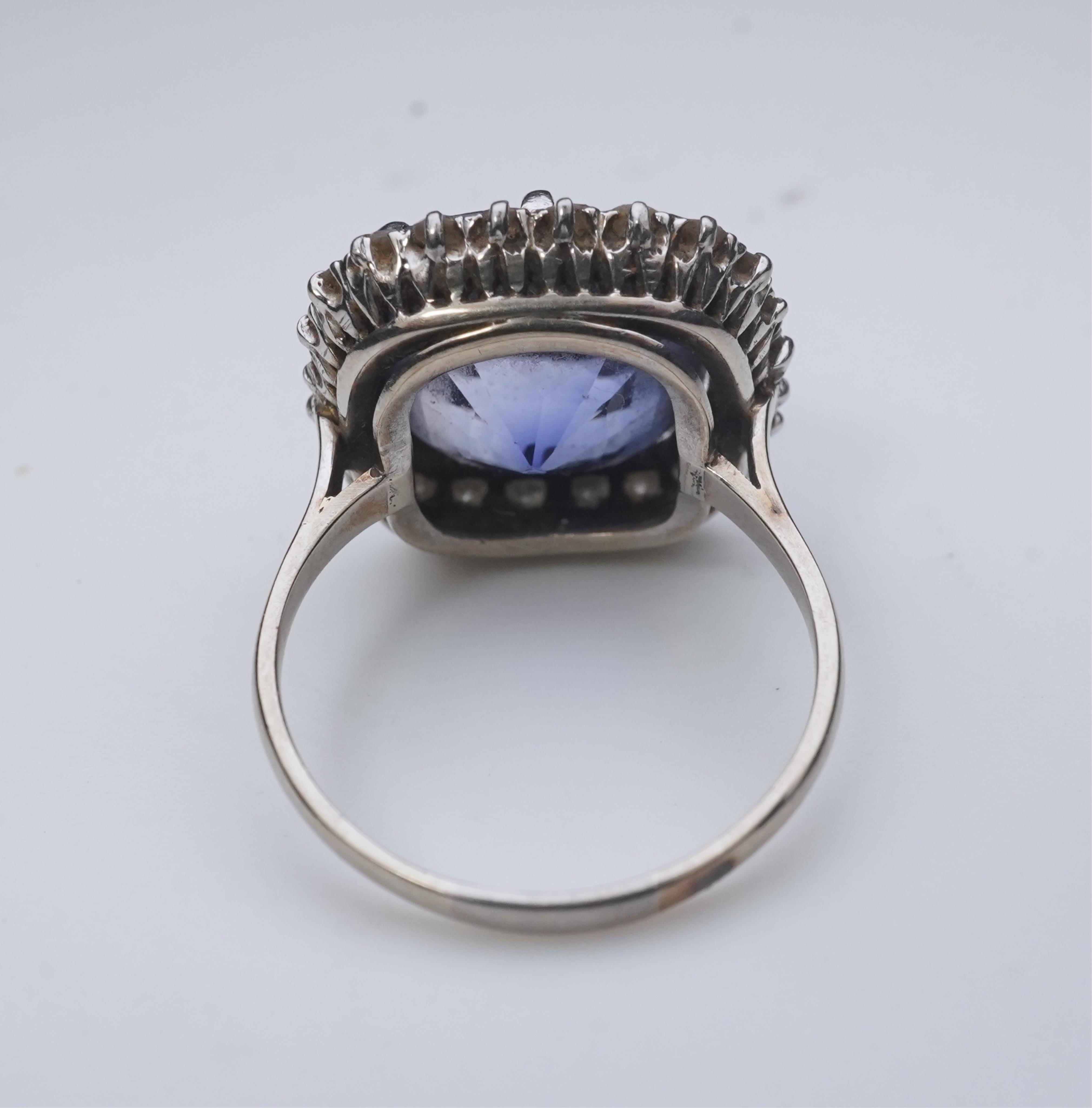 A synthetic sapphire and diamond cluster ring, early 20th century